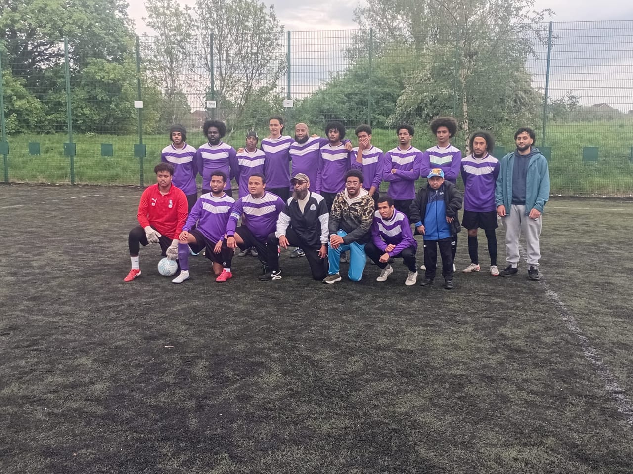 Manchester Victoria FC players and coaches together after a match at Harpurhey